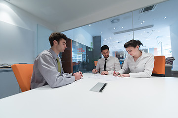 Image showing young couple signing contract documents on partners back