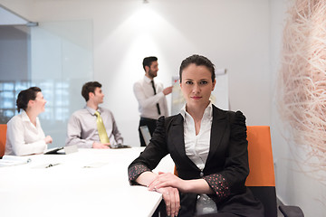 Image showing young business woman on meeting  using laptop computer