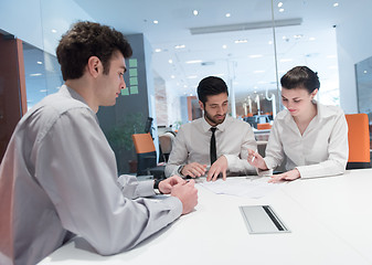 Image showing young couple signing contract documents on partners back