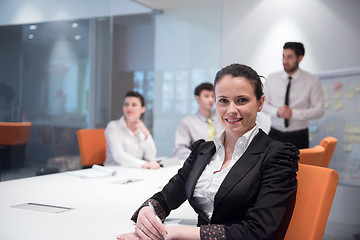 Image showing young business woman on meeting  using laptop computer