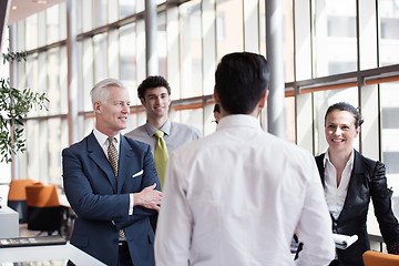 Image showing young startup businessman making presentation to senior investio