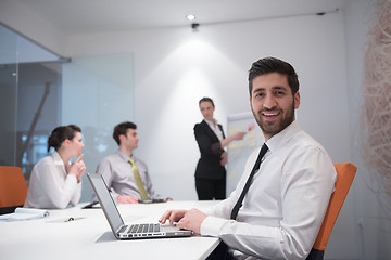 Image showing young business man at meeting