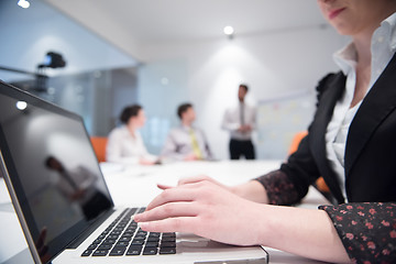 Image showing woman hands typing on laptop keyboard at business meeting