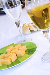 Image showing Close up on a plate of cheese with Wine Glasses
