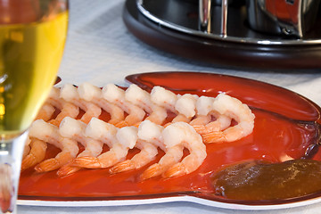 Image showing Shrimps on a Plate with a Blurred Wine Glass in the foreground