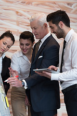 Image showing business people group brainstorming and taking notes to flipboar