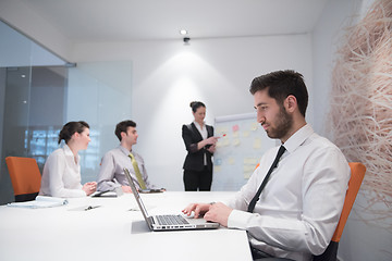 Image showing young business man at meeting