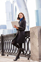 Image showing middle-aged woman in a dark coat