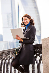 Image showing beautiful woman with a laptop