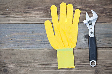 Image showing yellow glove and adjustable spanner