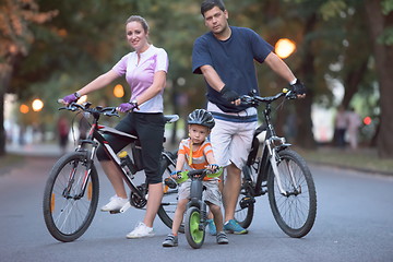 Image showing young family with bicycles