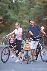 Image showing young family with bicycles