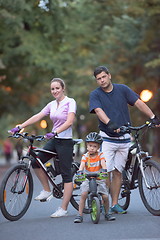 Image showing young family with bicycles