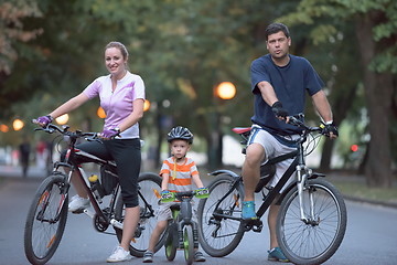 Image showing young family with bicycles