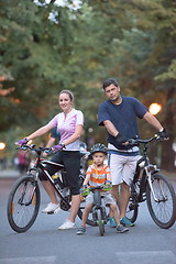 Image showing young family with bicycles