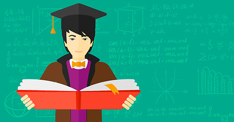 Image showing Man in graduation cap holding book.