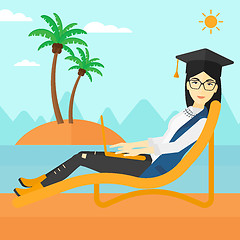 Image showing Graduate lying on chaise lounge with laptop.