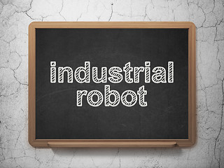 Image showing Manufacuring concept: Industrial Robot on chalkboard background