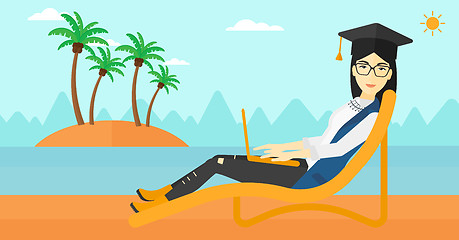 Image showing Graduate lying on chaise lounge with laptop.