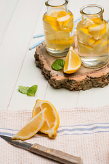 Image showing Lemon and lime slices in jars