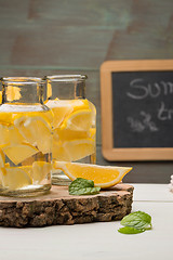 Image showing Lemon and lime slices in jars