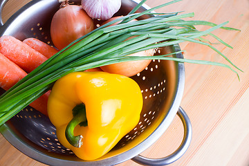 Image showing vegetables on a wooden background