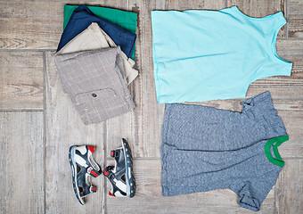 Image showing Flat lay photography of some boy\'s casual outfits. 