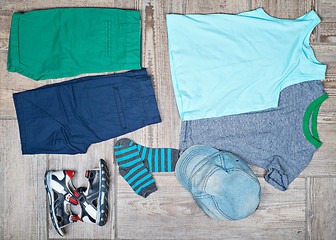 Image showing Flat lay photography of kid\'s casual outfits. 