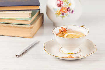 Image showing Tea with  lemon and books on the table