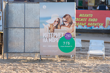 Image showing Anapa, Russia - September 21, 2015: Online Advertising the sea from a megaphone network to the locker room on the sandy beach