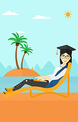 Image showing Graduate lying on chaise lounge with laptop.