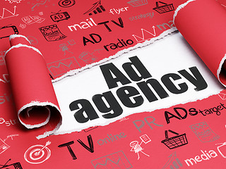 Image showing Advertising concept: black text Ad Agency under the piece of  torn paper