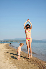 Image showing Mother and daughter in same bikinis