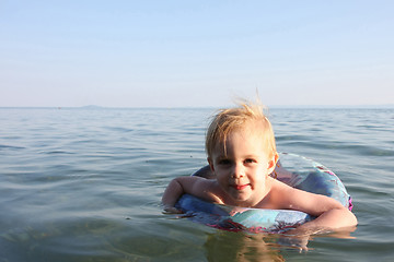 Image showing Baby girl enjoying in the sea