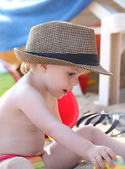 Image showing Baby girl playing on the beach