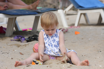 Image showing Baby girl playing on the beach