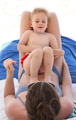 Image showing Mother and her baby girl on the beach