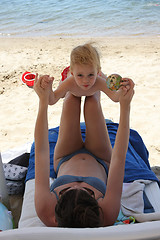 Image showing Mother and her baby girl on the beach