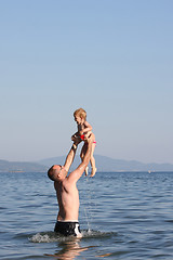 Image showing Father playing with his baby girl