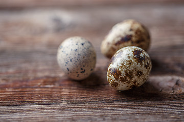 Image showing Group of quail eggs on thewooden background