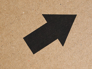 Image showing Black arrow on cardboard