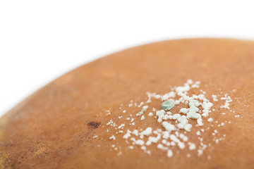 Image showing Pear with white area of fungus growing on it, selective focus