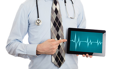 Image showing Doctor holding tablet - Heartbeat graph