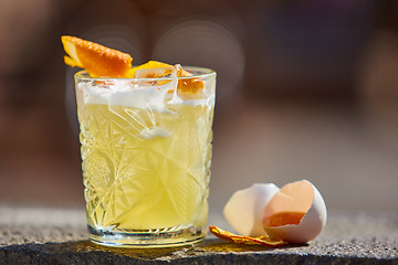 Image showing whiskey sour in the sunlight.