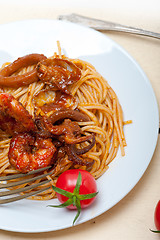 Image showing Italian seafood spaghetti pasta on red tomato sauce 