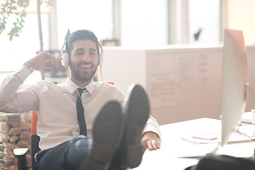 Image showing relaxed young business man at office