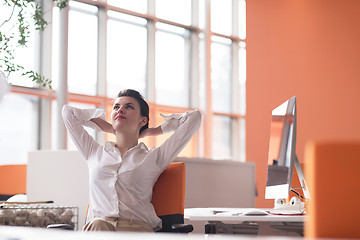 Image showing happy young business woman relaxing and geting insiration