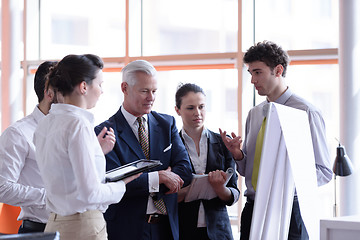 Image showing young startup businessman making presentation to senior investio