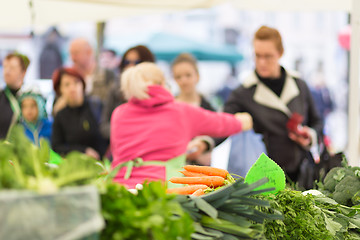 Image showing People buying vegetable at local food market. 