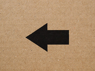 Image showing Black arrow on cardboard